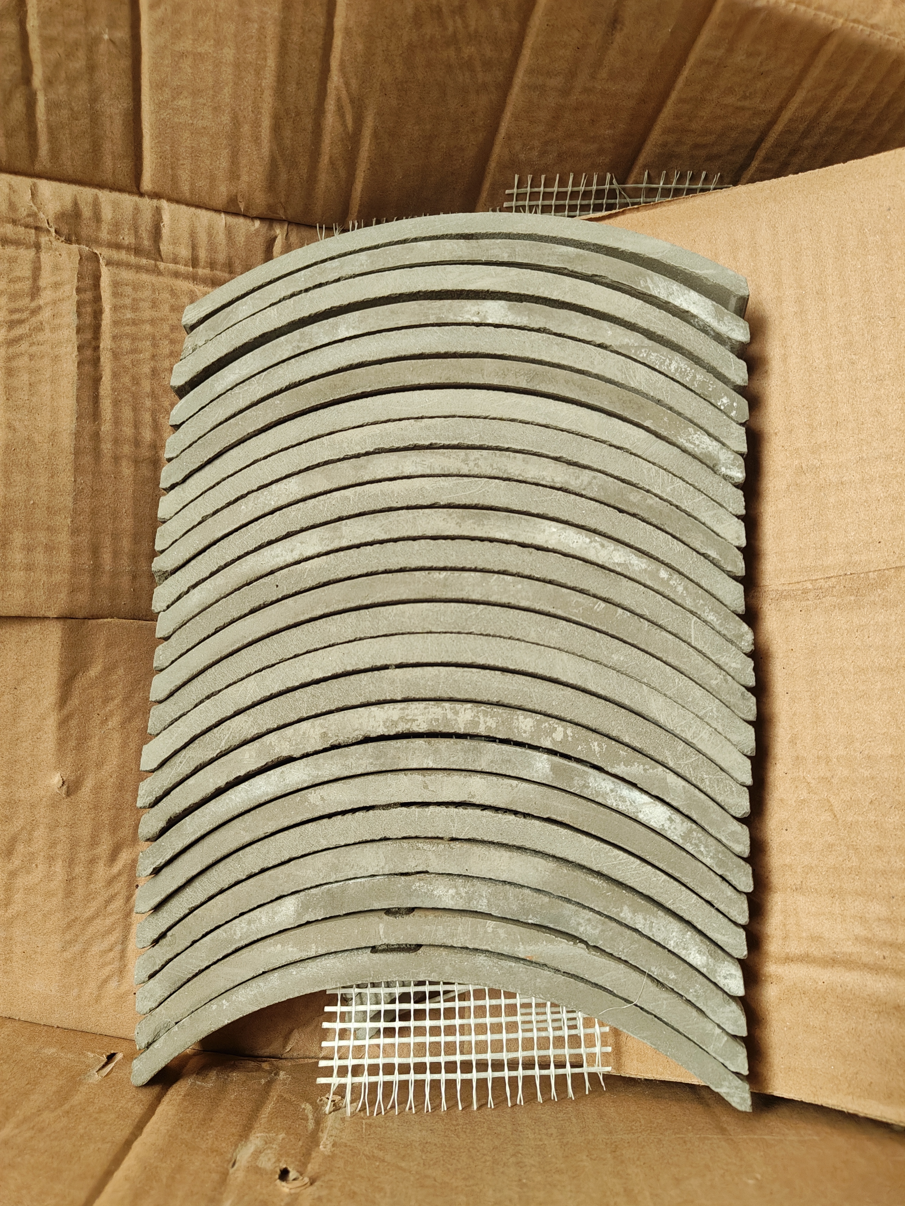 Mesh-backed tiles